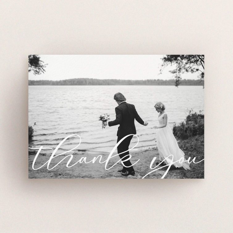 A photo wedding thank you card design titled "One Photo". It is an A6 card in a landscape orientation. It is a photographic photo wedding thank you card with room for 1 photo. "One Photo" is available as a flat card, with mainly white colouring.