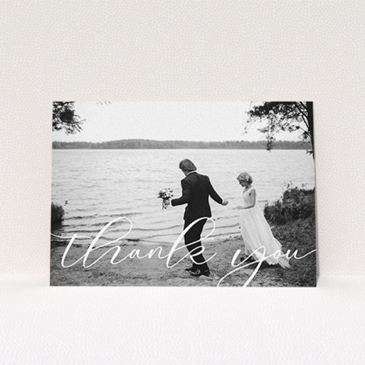 A photo wedding thank you card design titled "One Photo". It is an A6 card in a landscape orientation. It is a photographic photo wedding thank you card with room for 1 photo. "One Photo" is available as a flat card, with mainly white colouring.