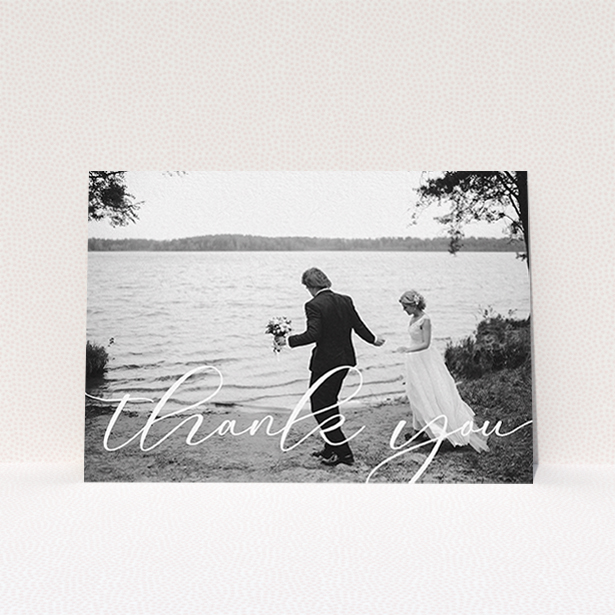 A photo wedding thank you card design titled "One Photo". It is an A6 card in a landscape orientation. It is a photographic photo wedding thank you card with room for 1 photo. "One Photo" is available as a flat card, with mainly white colouring.