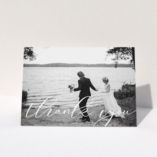 A photo wedding thank you card design named "One Photo". It is an A6 card in a landscape orientation. It is a photographic photo wedding thank you card with room for 1 photo. "One Photo" is available as a folded card, with mainly white colouring.