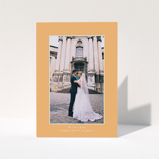 A photo wedding thank you card design titled "Orange and blue". It is an A6 card in a portrait orientation. It is a photographic photo wedding thank you card with room for 1 photo. "Orange and blue" is available as a folded card, with tones of orange and blue.