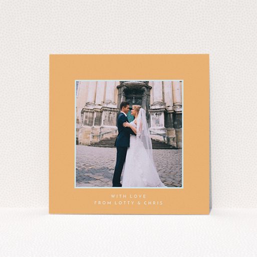 A photo wedding thank you card design called "Orange and blue". It is a square (148mm x 148mm) card in a square orientation. It is a photographic photo wedding thank you card with room for 1 photo. "Orange and blue" is available as a flat card, with tones of orange and blue.