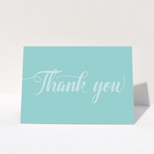 A photo wedding thank you card design named "Pastel blue calligraphy". It is an A6 card in a landscape orientation. "Pastel blue calligraphy" is available as a folded card, with mainly blue colouring.