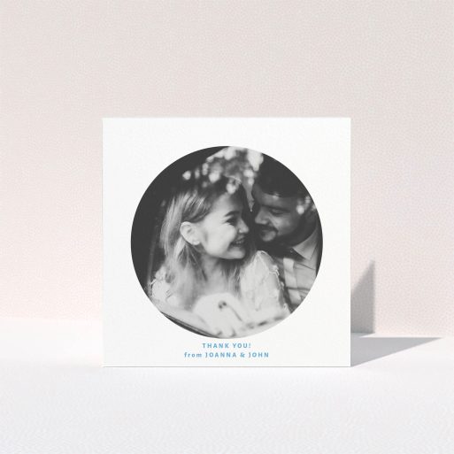 A photo wedding thank you card design titled "Photo hole". It is a square (148mm x 148mm) card in a square orientation. It is a photographic photo wedding thank you card with room for 1 photo. "Photo hole" is available as a folded card, with tones of white and blue.