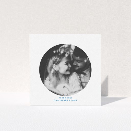 A photo wedding thank you card design titled "Photo hole". It is a square (148mm x 148mm) card in a square orientation. It is a photographic photo wedding thank you card with room for 1 photo. "Photo hole" is available as a folded card, with tones of white and blue.