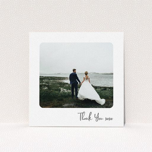 A photo wedding thank you card design called "Rounded Thanks". It is a square (148mm x 148mm) card in a square orientation. It is a photographic photo wedding thank you card with room for 1 photo. "Rounded Thanks" is available as a flat card, with mainly white colouring.