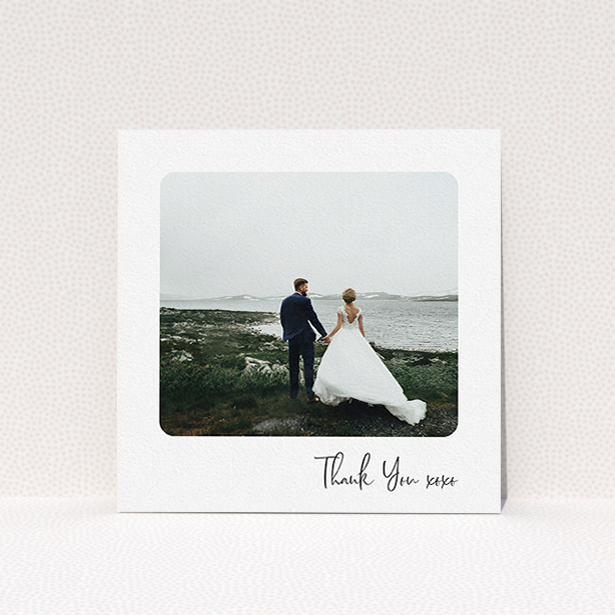 A photo wedding thank you card design called "Rounded Thanks". It is a square (148mm x 148mm) card in a square orientation. It is a photographic photo wedding thank you card with room for 1 photo. "Rounded Thanks" is available as a flat card, with mainly white colouring.