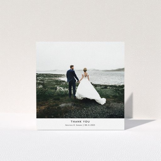 A photo wedding thank you card design named "Sans Serif". It is a square (148mm x 148mm) card in a square orientation. It is a photographic photo wedding thank you card with room for 1 photo. "Sans Serif" is available as a folded card, with mainly white colouring.