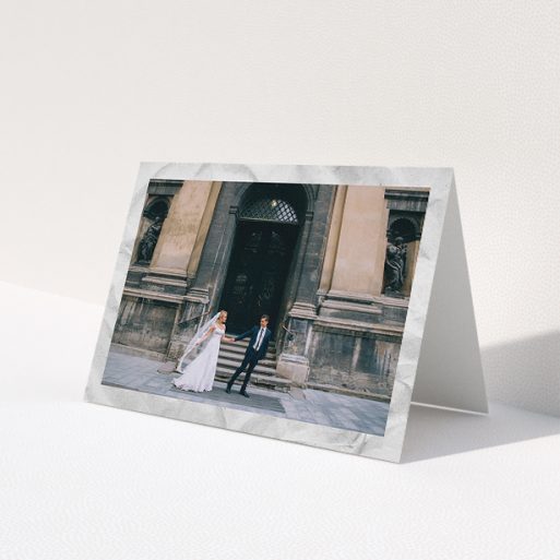 A photo wedding thank you card named 'Sat on Marble'. It is an A5 card in a landscape orientation. It is a photographic photo wedding thank you card with room for 1 photo. 'Sat on Marble' is available as a folded card, with mainly white colouring.