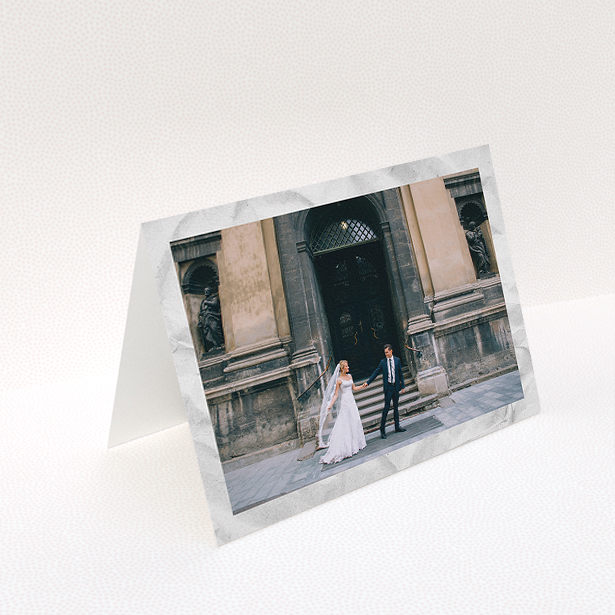 A photo wedding thank you card named "Sat on Marble". It is an A5 card in a landscape orientation. It is a photographic photo wedding thank you card with room for 1 photo. "Sat on Marble" is available as a folded card, with mainly white colouring.