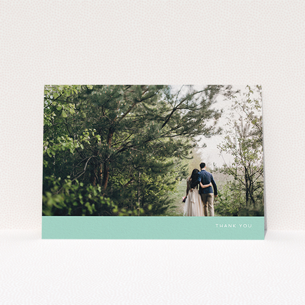 A photo wedding thank you card design called "Simple Mint". It is an A6 card in a landscape orientation. It is a photographic photo wedding thank you card with room for 1 photo. "Simple Mint" is available as a flat card, with tones of green and white.