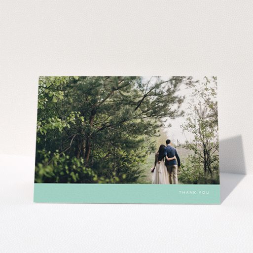 A photo wedding thank you card template titled "Simple Mint". It is an A6 card in a landscape orientation. It is a photographic photo wedding thank you card with room for 1 photo. "Simple Mint" is available as a folded card, with tones of green and white.