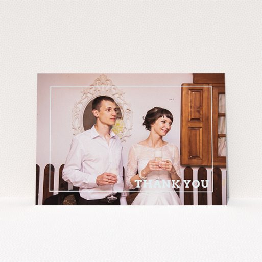 A photo wedding thank you card design titled "Simple Thank You Frame". It is an A5 card in a landscape orientation. It is a photographic photo wedding thank you card with room for 1 photo. "Simple Thank You Frame" is available as a flat card, with mainly white colouring.
