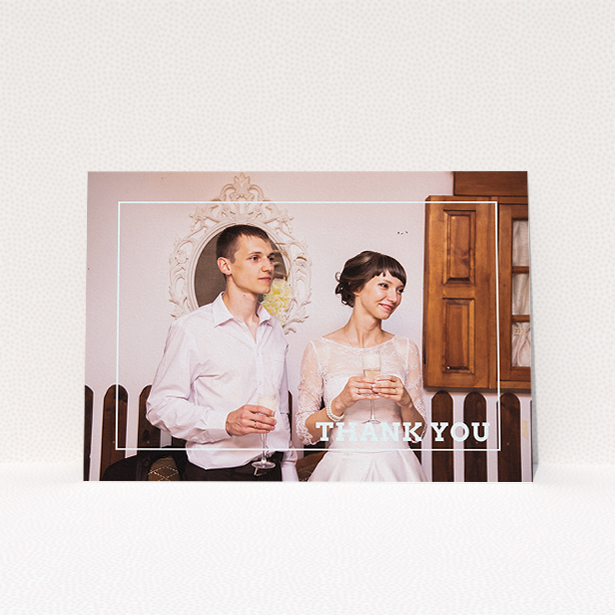 A photo wedding thank you card design titled "Simple Thank You Frame". It is an A5 card in a landscape orientation. It is a photographic photo wedding thank you card with room for 1 photo. "Simple Thank You Frame" is available as a flat card, with mainly white colouring.