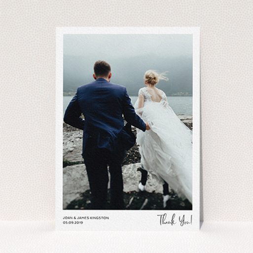 A photo wedding thank you card design called "Simple Wedding Thank You". It is an A6 card in a portrait orientation. It is a photographic photo wedding thank you card with room for 1 photo. "Simple Wedding Thank You" is available as a flat card, with mainly white colouring.