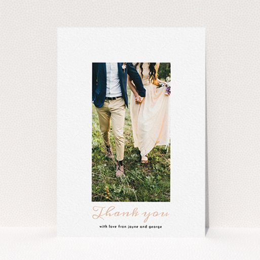 A photo wedding thank you card called "Small and Central". It is an A6 card in a portrait orientation. It is a photographic photo wedding thank you card with room for 1 photo. "Small and Central" is available as a flat card, with tones of white and pink.
