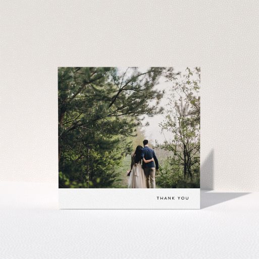 A photo wedding thank you card called "Thankful with Simplicity". It is a square (148mm x 148mm) card in a square orientation. It is a photographic photo wedding thank you card with room for 1 photo. "Thankful with Simplicity" is available as a folded card, with mainly white colouring.