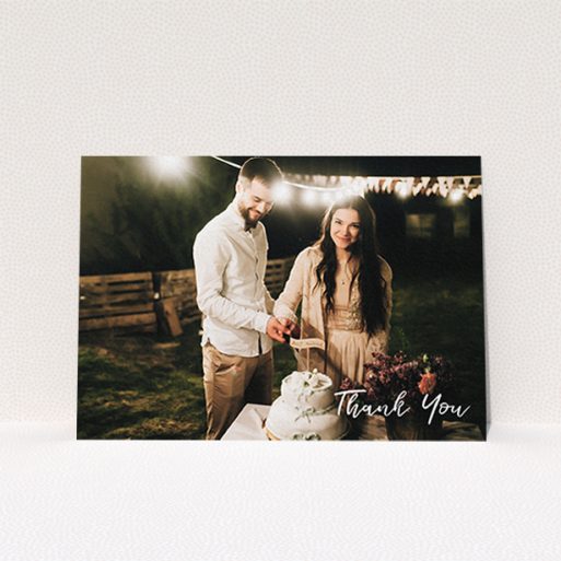 A photo wedding thank you card design named "Thanks From The Corner". It is an A6 card in a landscape orientation. It is a photographic photo wedding thank you card with room for 1 photo. "Thanks From The Corner" is available as a flat card, with mainly white colouring.