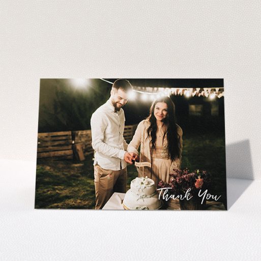 A photo wedding thank you card called "Thanks From The Corner". It is an A6 card in a landscape orientation. It is a photographic photo wedding thank you card with room for 1 photo. "Thanks From The Corner" is available as a folded card, with mainly white colouring.