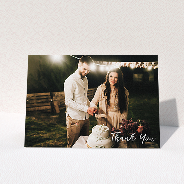 A photo wedding thank you card called "Thanks From The Corner". It is an A6 card in a landscape orientation. It is a photographic photo wedding thank you card with room for 1 photo. "Thanks From The Corner" is available as a folded card, with mainly white colouring.