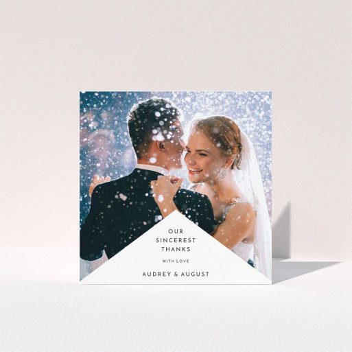 A photo wedding thank you card design called "Triangular thank you". It is a square (148mm x 148mm) card in a square orientation. It is a photographic photo wedding thank you card with room for 1 photo. "Triangular thank you" is available as a folded card, with mainly white colouring.