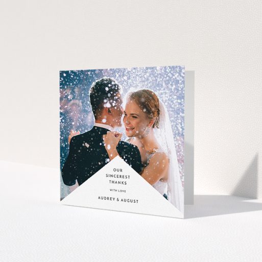 A photo wedding thank you card design called 'Triangular thank you'. It is a square (148mm x 148mm) card in a square orientation. It is a photographic photo wedding thank you card with room for 1 photo. 'Triangular thank you' is available as a folded card, with mainly white colouring.