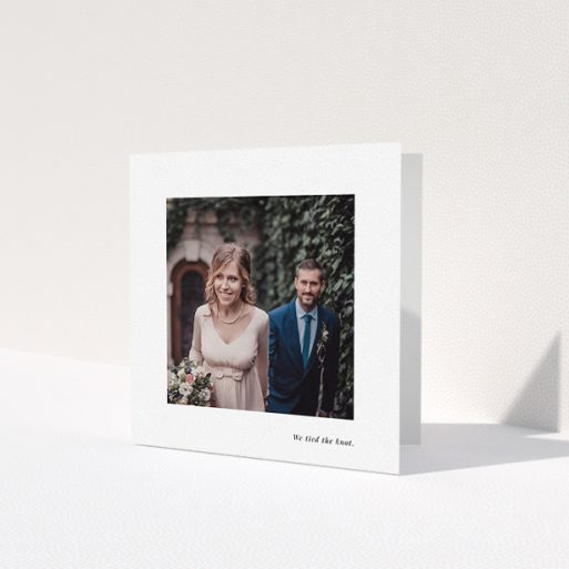 A photo wedding thank you card design titled 'We tied the knot'. It is a square (148mm x 148mm) card in a square orientation. It is a photographic photo wedding thank you card with room for 1 photo. 'We tied the knot' is available as a folded card, with mainly white colouring.
