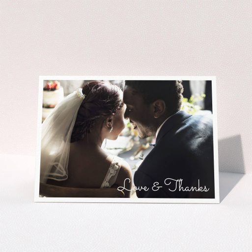A photo wedding thank you card design named "Wedding Thanks Landscape". It is an A5 card in a landscape orientation. It is a photographic photo wedding thank you card with room for 1 photo. "Wedding Thanks Landscape" is available as a folded card, with mainly white colouring.