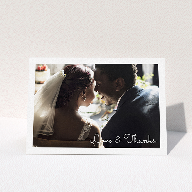 A photo wedding thank you card design named "Wedding Thanks Landscape". It is an A5 card in a landscape orientation. It is a photographic photo wedding thank you card with room for 1 photo. "Wedding Thanks Landscape" is available as a folded card, with mainly white colouring.