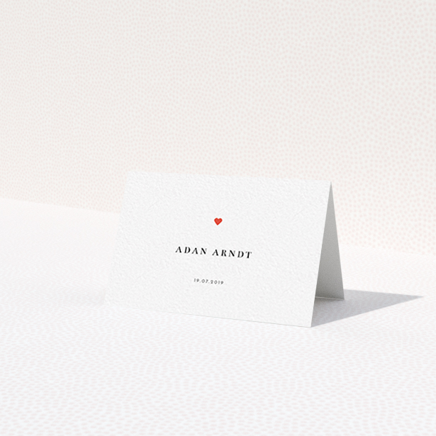A place setting card design titled 'A little heart'. It is an 85 x 55mm card in a landscape orientation. 'A little heart' is available as a folded card, with tones of white and red.