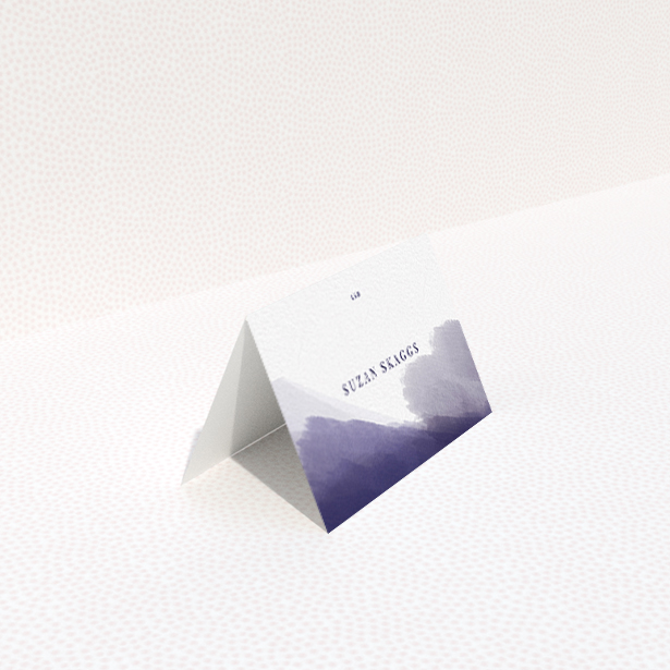 A place setting card called "Blue and Cream". It is an 85 x 55mm card in a landscape orientation. "Blue and Cream" is available as a folded card, with mainly purple/dark pink colouring.