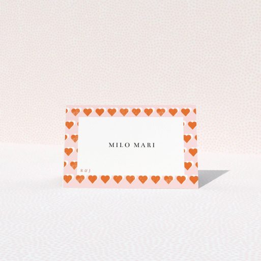 Place Setting Card Design - "Rustic Hearts" A place setting card design named "Rustic Hearts". It is an 85 x 55mm card in a landscape orientation. "Rustic Hearts" is available as a folded card, with tones of pink and orange.