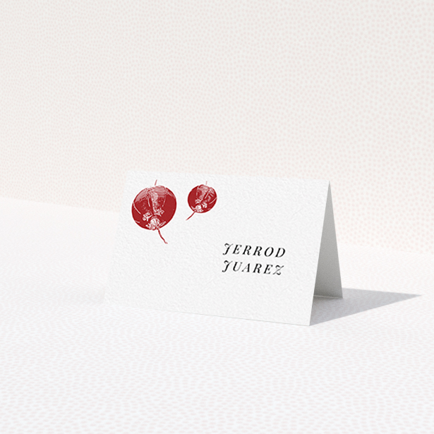 A place setting card called 'Shanghai Nights'. It is an 85 x 55mm card in a landscape orientation. 'Shanghai Nights' is available as a folded card, with tones of red and white.