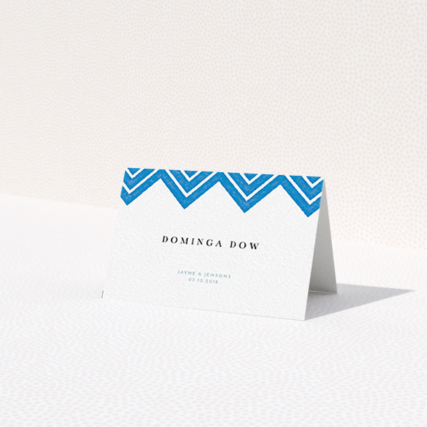 A place setting card named "Skiapthos". It is an 85 x 55mm card in a landscape orientation. "Skiapthos" is available as a folded card, with tones of blue and white.