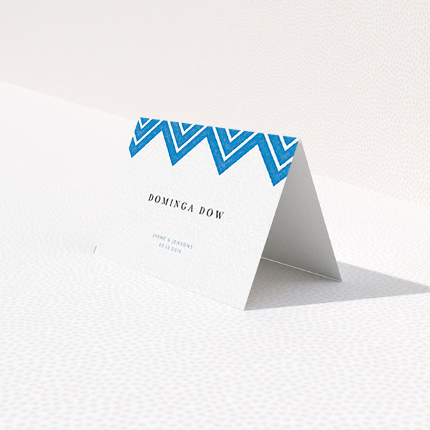 A place setting card named "Skiapthos". It is an 85 x 55mm card in a landscape orientation. "Skiapthos" is available as a folded card, with tones of blue and white.