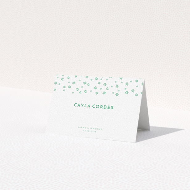 A place setting card design named "Stars at Night". It is an 85 x 55mm card in a landscape orientation. "Stars at Night" is available as a folded card, with tones of green and white.