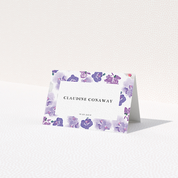 A place setting card design called "Violet Explosion". It is an 85 x 55mm card in a landscape orientation. "Violet Explosion" is available as a folded card, with mainly purple/dark pink colouring.