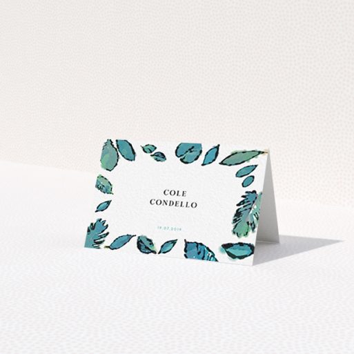 A place setting card called 'Woodland Ambush'. It is an 85 x 55mm card in a landscape orientation. 'Woodland Ambush' is available as a folded card, with tones of green and white.