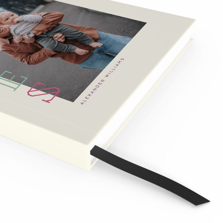 Portrait notebook cover design with colourful vertical text and one photo on the front cover.