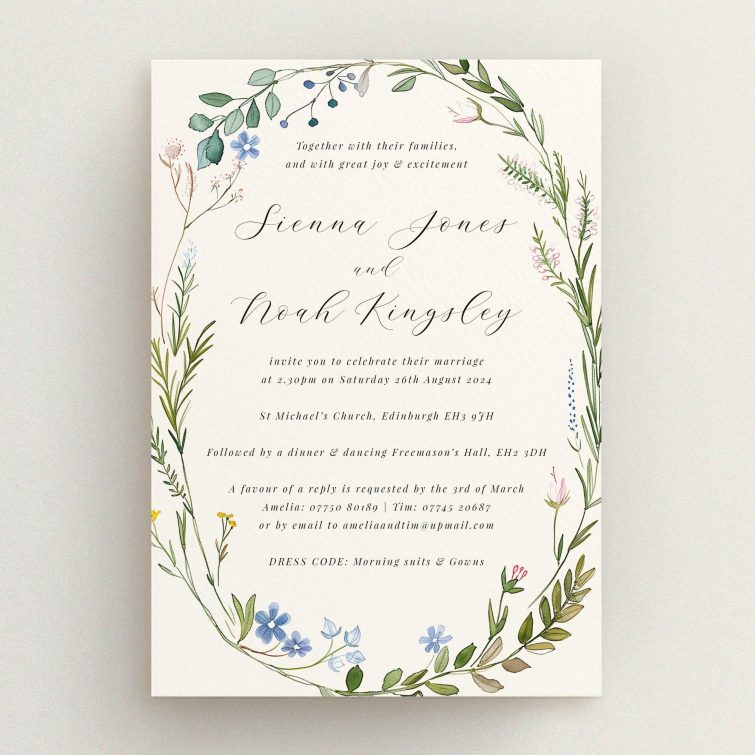 "Richmond Meadow wedding invitation featuring a wreath of wildflowers and foliage in pastel greens, blues, pinks, and yellows, embodying the beauty of an English countryside meadow.". This is a view of the front