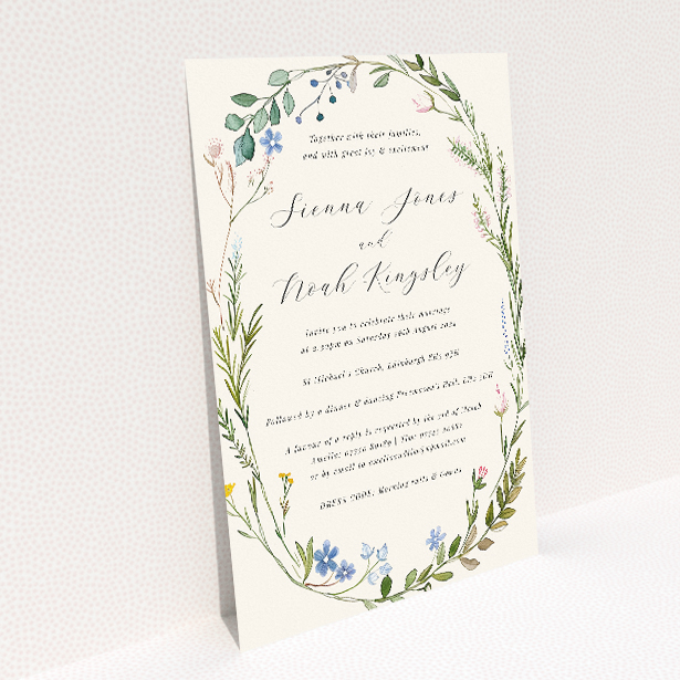 "Richmond Meadow wedding invitation featuring a wreath of wildflowers and foliage in pastel greens, blues, pinks, and yellows, embodying the beauty of an English countryside meadow.". This image shows the front and back sides together
