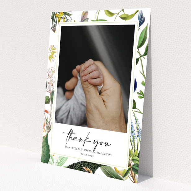 Baby thank you card with floral border and one photo of baby hand.