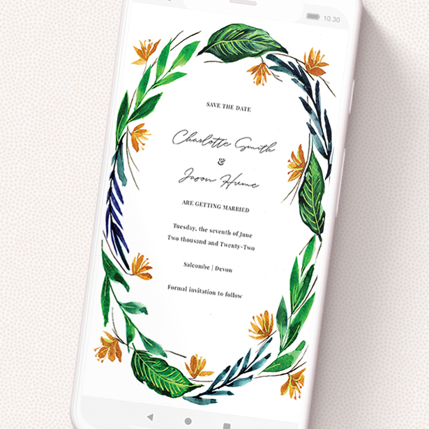 A save the date for whatsapp template titled 'Summer Whirl Wreath'. It is a smartphone screen sized card in a portrait orientation. 'Summer Whirl Wreath' is available as a flat card, with tones of green, dark blue and orange.