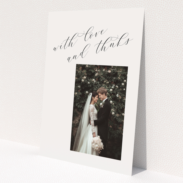 Elegant wedding thank you card with one photo and cursive text.