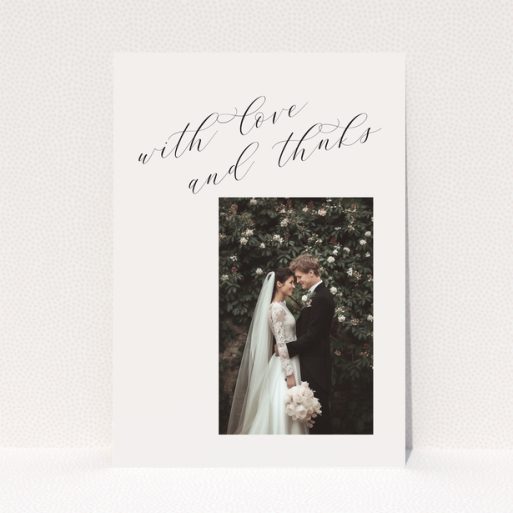 Elegant wedding thank you card with one photo and cursive text.