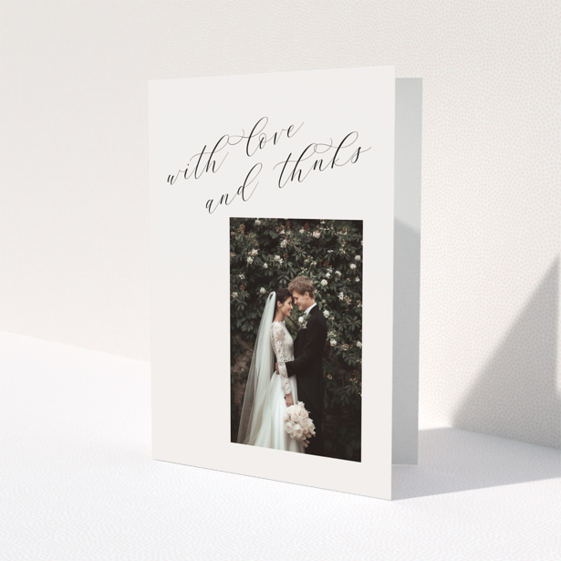 Elegant wedding thank you card with one photo and cursive text.