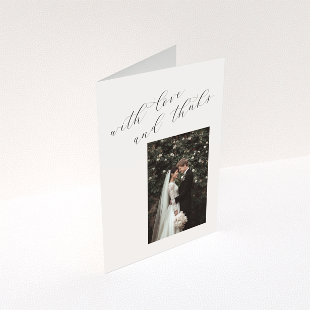 Elegant wedding thank you card with one photo and cursive text.