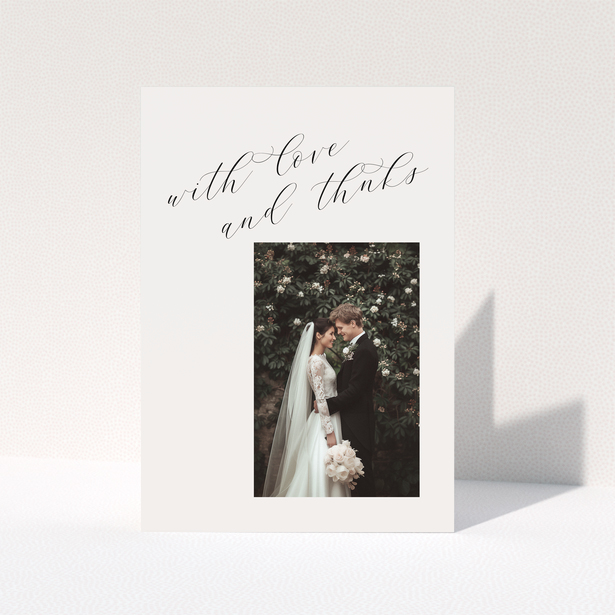 Elegant wedding thank you card with one photo and cursive text.