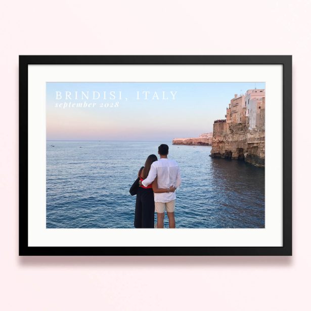 Framed and mounted photo print of a couple by the sea with cliffs in the background and text overlay.