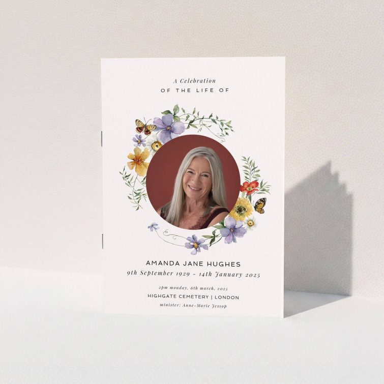 Funeral order of service program design featuring floral wreath with one photo.